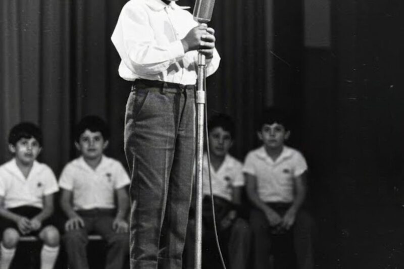 A LITTLE-KNOWN BEGINNING THAT LATER SHAPED GLOBAL MUSIC HISTORY: The earliest stage appearance of Michael Jackson is often described as a moment so small and fragile that few in the audience could have imagined what it would become. At just five years old, a young Michael Jackson reportedly stepped onto a modest stage for his first public performance, standing far smaller than the instruments, lights, and expectations around him, visibly nervous yet already drawn toward rhythm and movement in a way that felt instinctive rather than taught. What began as a brief, uncertain childhood appearance would later be remembered as the quiet spark behind one of the most influential entertainment careers in history, a moment where fear, innocence, and raw talent briefly collided before the world even knew his name.